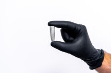 technology-tooth-implants-isolated-white-dentist-s-hand-black-latex-gloves.jpg
