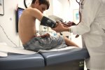 doctor-taking-boys-blood-pressure-nominated_t20_QKblPW.jpg