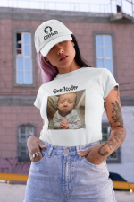tee-mockup-of-a-woman-with-a-tattooed-arm-wearing-a-dad-hat-on-the-street-31184.png